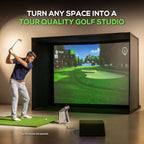 Man playing golf simulator in a home setup with a screen displaying a golf course.